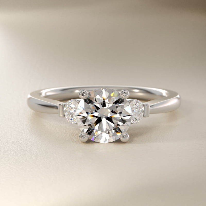 Petite Three-Stone Diamond Engagement Ring in Platinum