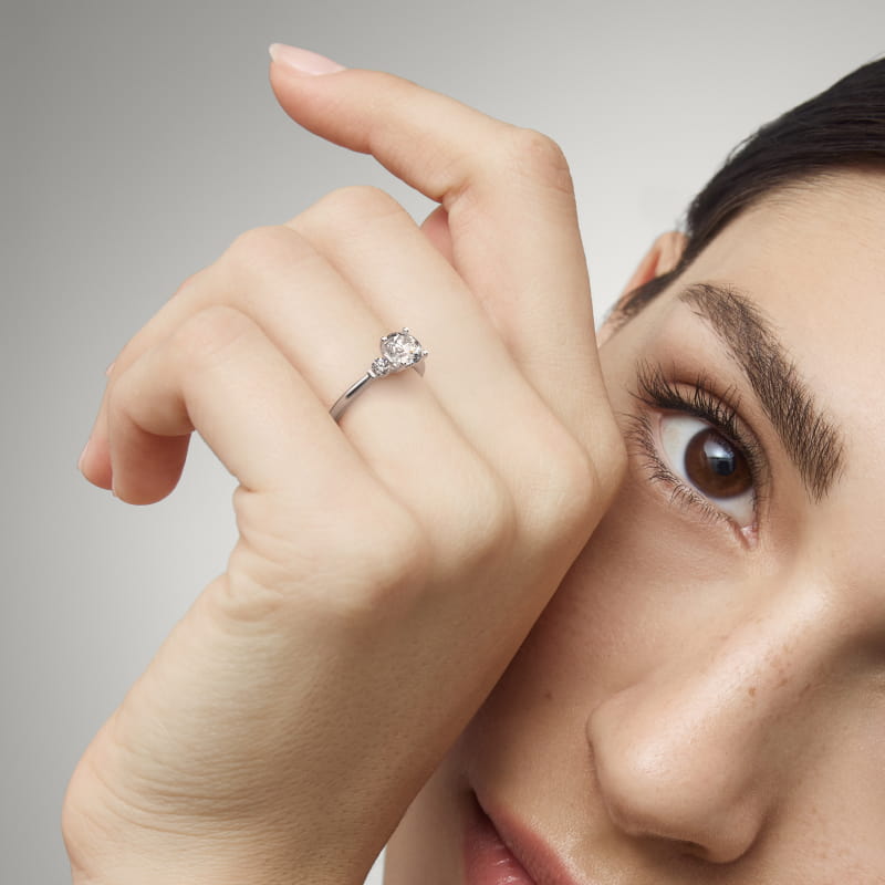 Petite Three-Stone Diamond Engagement Ring in Platinum