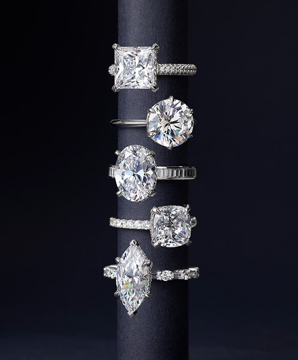 stacked diamond rings displayed on a jewelry stand